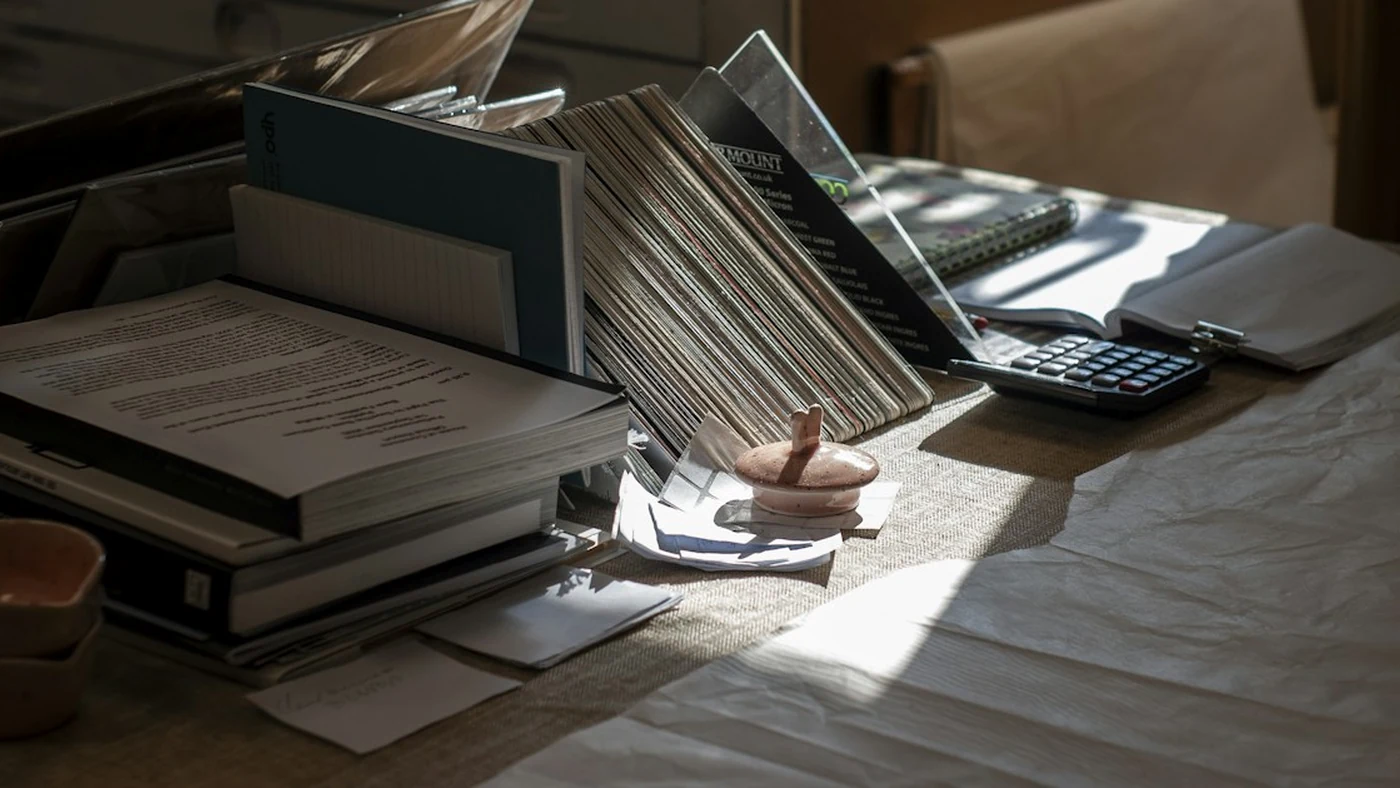 Paper documents and a calculator on a desk
